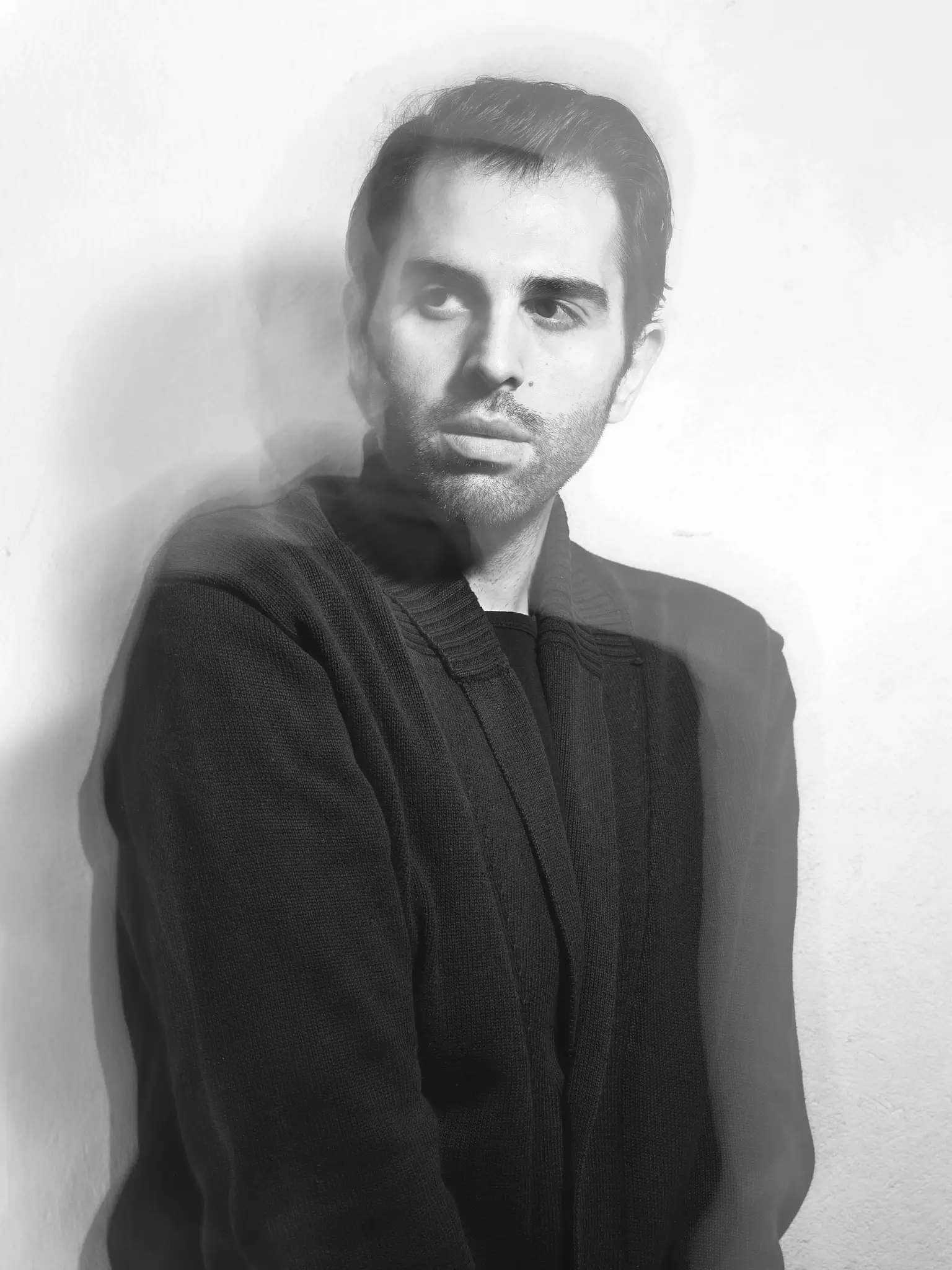 Long exposure black and white portrait of male model in studio