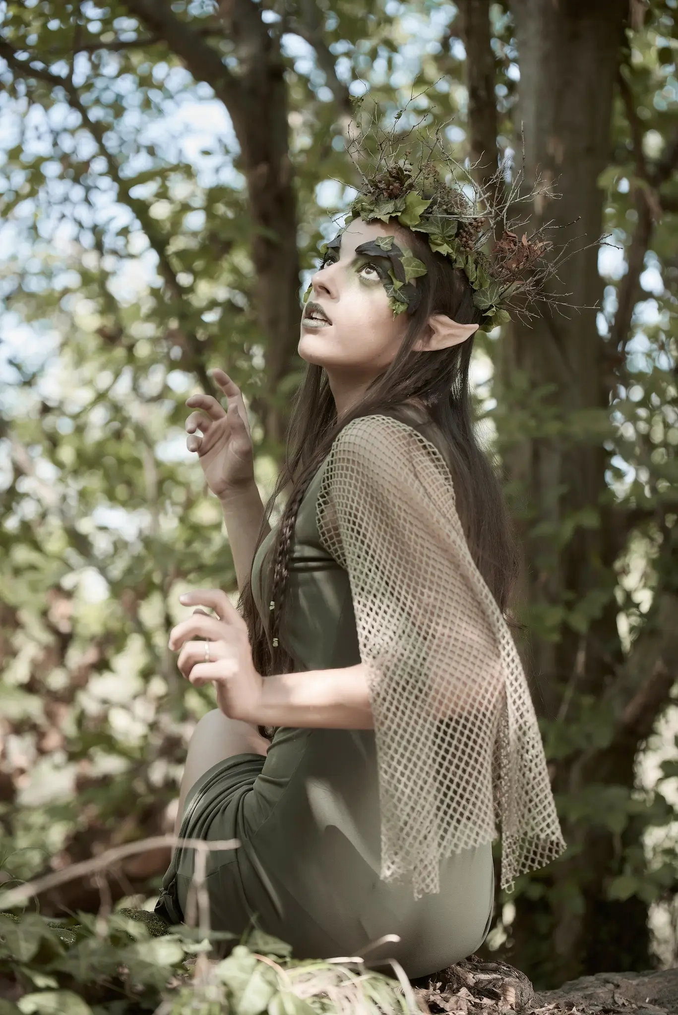 Outdoor portrait of a model with elvish dress and makeup