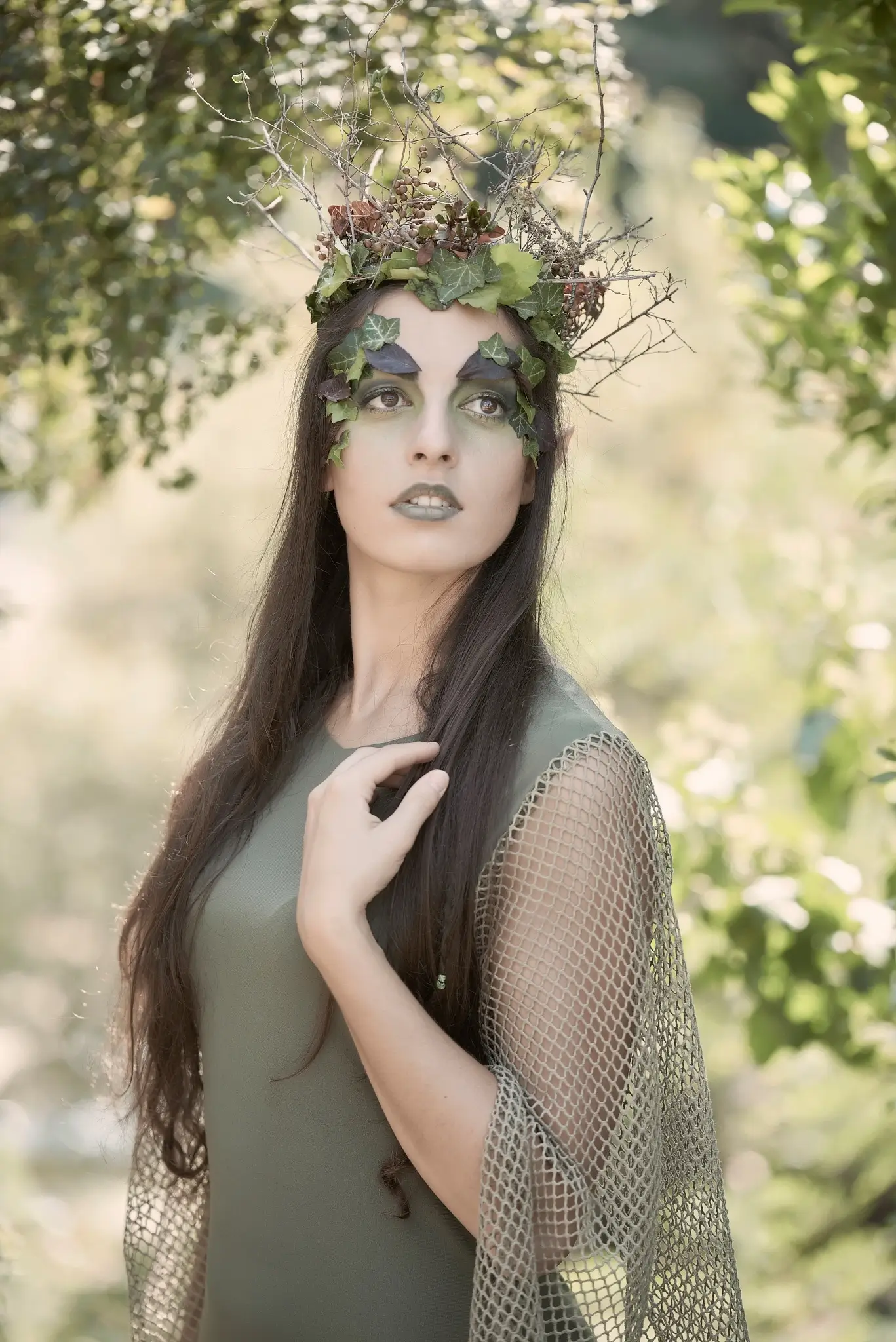 Outdoor portrait of a model with elvish dress and makeup