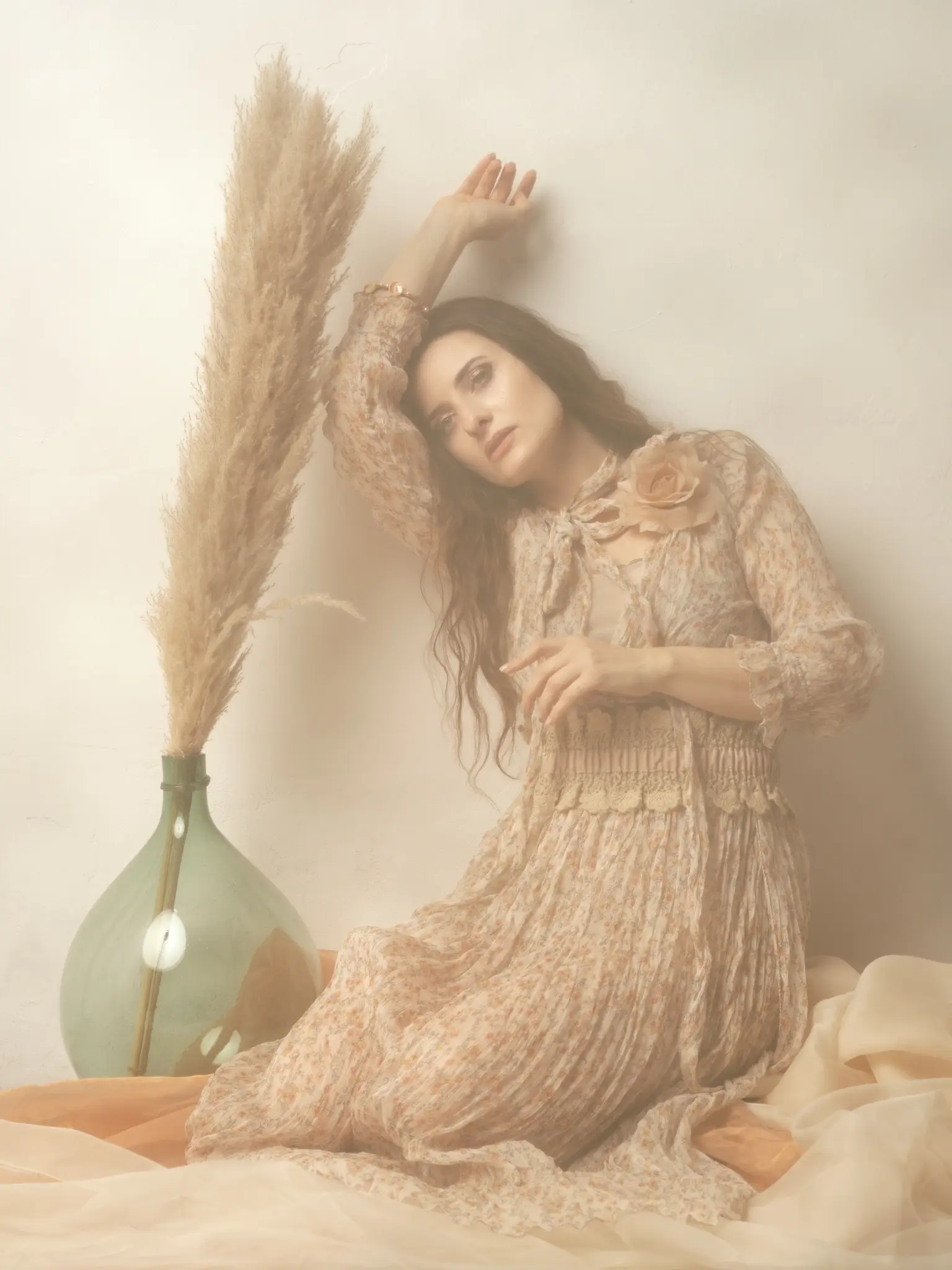 Artistic studio portrait of brunette model with flower dress