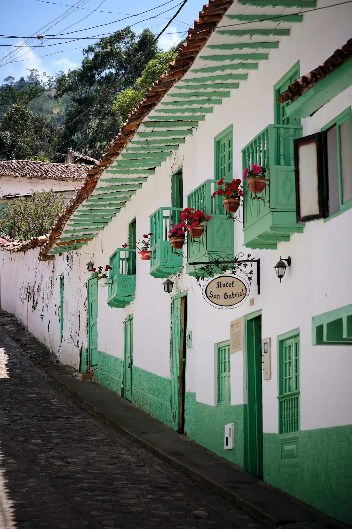 My Travel Diary Chronicles - View of the white and green buildings in El Cocuy